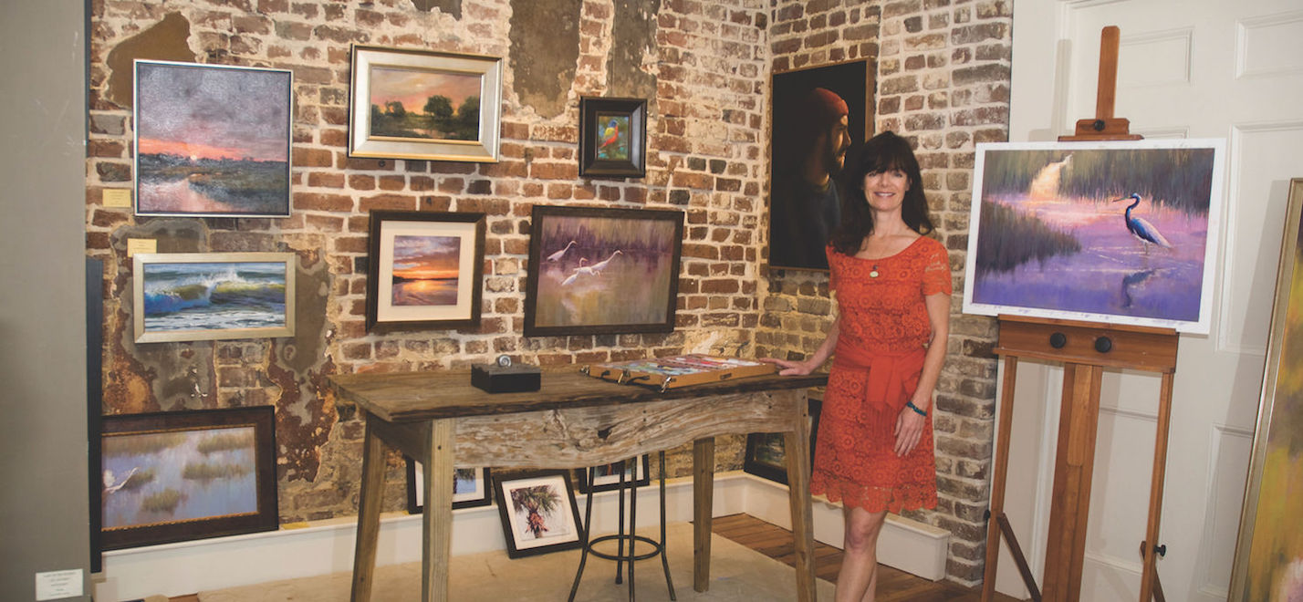 Cecilia Murray posing in her art gallery, Cecil Byrne Gallery, located in Charleston, South Carolina.